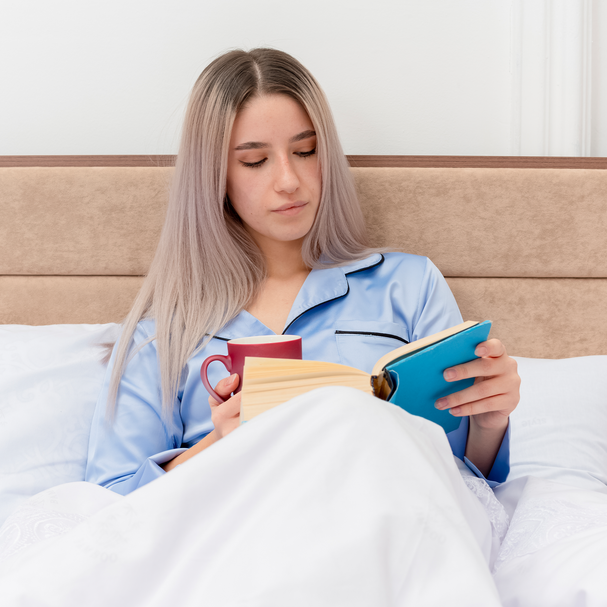 Woman relaxing in bed